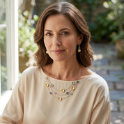 Woman wearing Burgundy Champagne floating circles layered necklace and matching earrings

