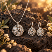 Constellation Orb necklace and matching drop earrings with silver tone openwork design and aqua sparkling accents on dark stone

