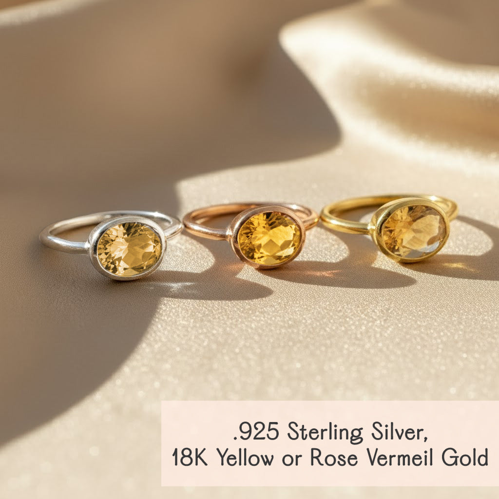 Three oval-cut citrine rings in 18K rose gold, yellow gold and 925 sterling silver settings, faceted yellow gemstones for November birthstone collection, handcrafted minimalist gold jewelry.