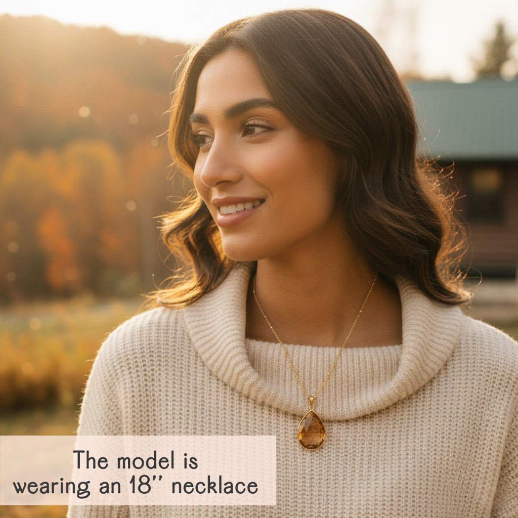 Woman wearing citrine birthstone pendant necklace layered-style, golden-yellow gemstone drop on an 18-inch chain, personalized November birthday jewelry gift for women.