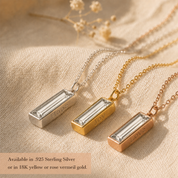 Clear quartz bar necklaces displayed in sterling silver, yellow gold, and rose gold finishes.