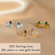Cluster birthstone bar stud earrings arranged on soft satin fabric, available in .925 sterling silver, 18k yellow gold vermeil, or rose gold vermeil. Dainty bezel-set gemstones represent all twelve birthstones, perfect for birthday gifts, bridesmaid jewelry, or personalized mom earrings. Minimalist multi-stone studs with vibrant, meaningful gemstone accents for everyday elegance.