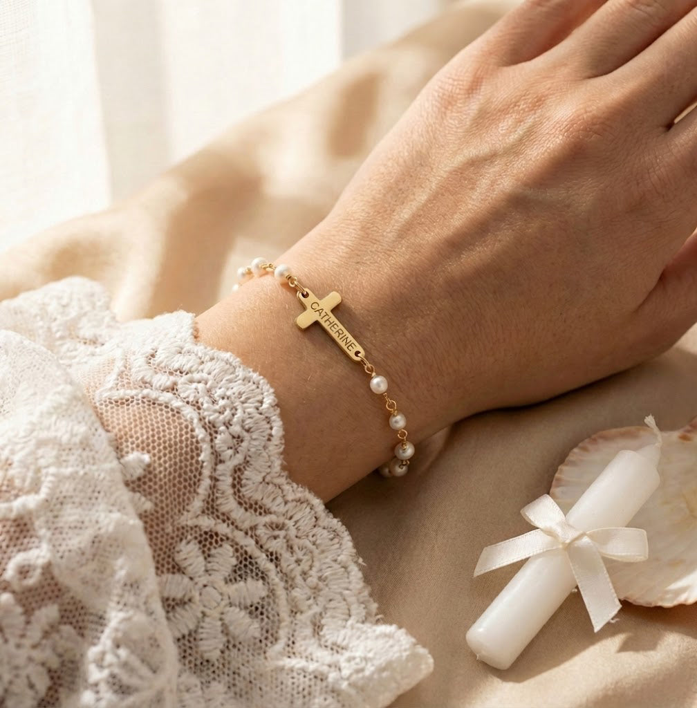 Sterling silver personalized cross bracelet with hand-engraved name and date; minimalist faith accessory for everyday wear or special occasions.