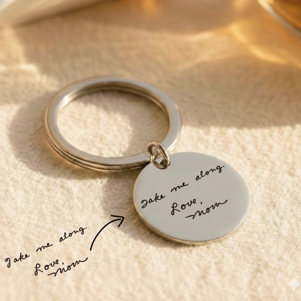 Close-up of custom engraved circle keychain showing clean, high-contrast engraving on polished stainless steel. Personalized round keychain engraved with name and message. Minimalist metal keychain designed for durability and everyday wear, perfect as a keepsake gift for loved ones.