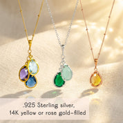 Lineup of three custom birthstone mom necklaces displayed on a white background, featuring prong-set teardrop birthstones in rich jewel tones on cable and satellite chains in sterling silver, yellow gold filled, and rose gold filled. Personalized family jewelry where you choose birthstones for children or grandchildren, a beautiful Mother’s Day or birthday gift for mom, new mom, or grandma.