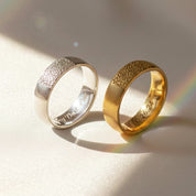 2 dog nose print rings on a log. Dog nose print ring, custom pet jewelry, personalized dog ring, sterling silver, vermeil gold, rose gold, pet memorial ring, engraved pet keepsake, dog lover gift, unique pet ring, dog nose jewelry, custom engraved ring, pet portrait jewelry, dog owner gift