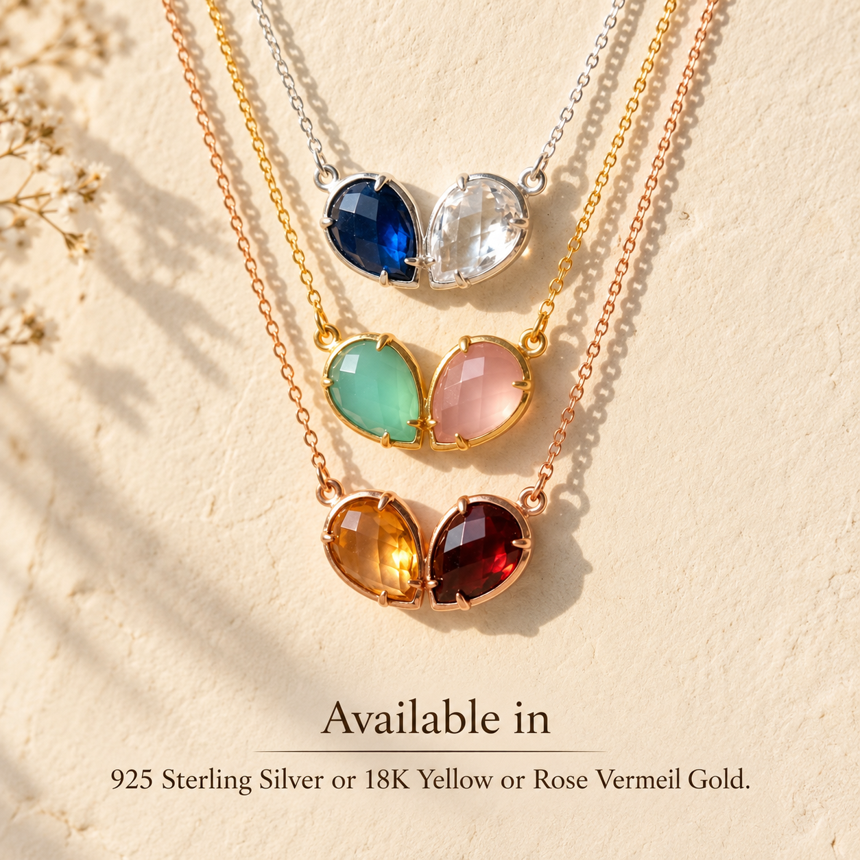 Two birthstone necklaces shown in sterling silver, yellow gold and rose gold vermeil with colorful teardrop gemstones.
