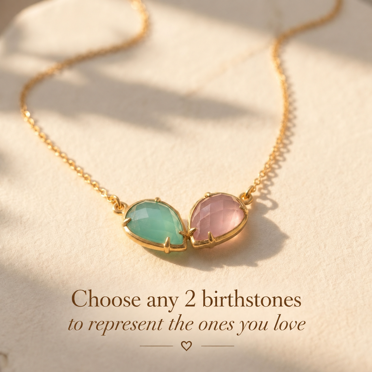 Two birthstone necklace with customizable teardrop gemstones chosen to represent two loved ones or meaningful birth months.