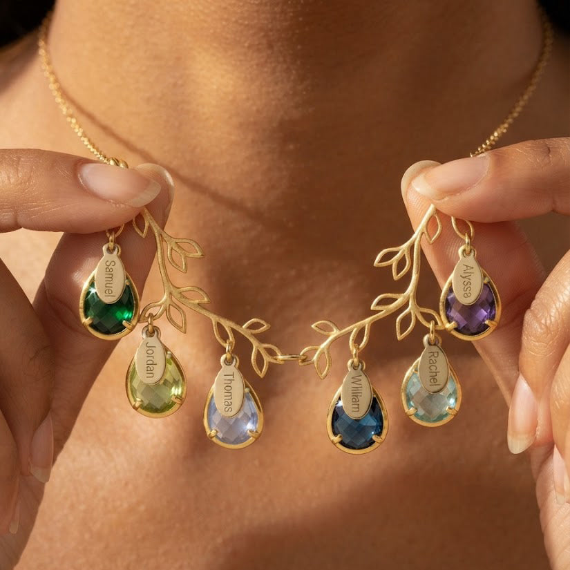 Personalized double-branch family tree necklace with colorful teardrop birthstones and engraved children's name charms in yellow gold.
