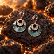 Sea Ice Layered Halo drop earrings with textured aqua and metallic circle design on dark stone

