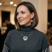 Woman wearing Sea Ice Layered Halo necklace and matching circular earrings
