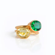 Two oval gemstone rings in vermeil rose gold and yellow gold rest against a white background. Emerald quartz sits on top, Citrine quartz is on the bottom. Stacking rings, birthstone stacking rings, May birthstone ring, November birthstone ring, gift for mom with many children