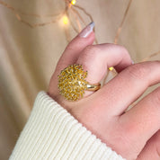 Model wearing a gold burst explosion statement ring - one size. fits sizes 7 and up, silver and gold plating. bold ring, boho ring, statement jewelry