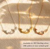 Personalized leaf necklace available in sterling silver, yellow gold, or rose gold, shown with engraved leaf charms for a meaningful custom jewelry gift.