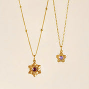 delicate birthstone flower necklace featuring a gold filled bloom pendant with a sparkling center birthstone and optional engraving on the reverse, personalized birthstone flower necklace for her crafted in sterling silver or gold filled, perfect personalized gift for birthdays anniversaries Mother’s Day daughter friend best friend layering minimalist jewelry everyday wear meaningful keepsake