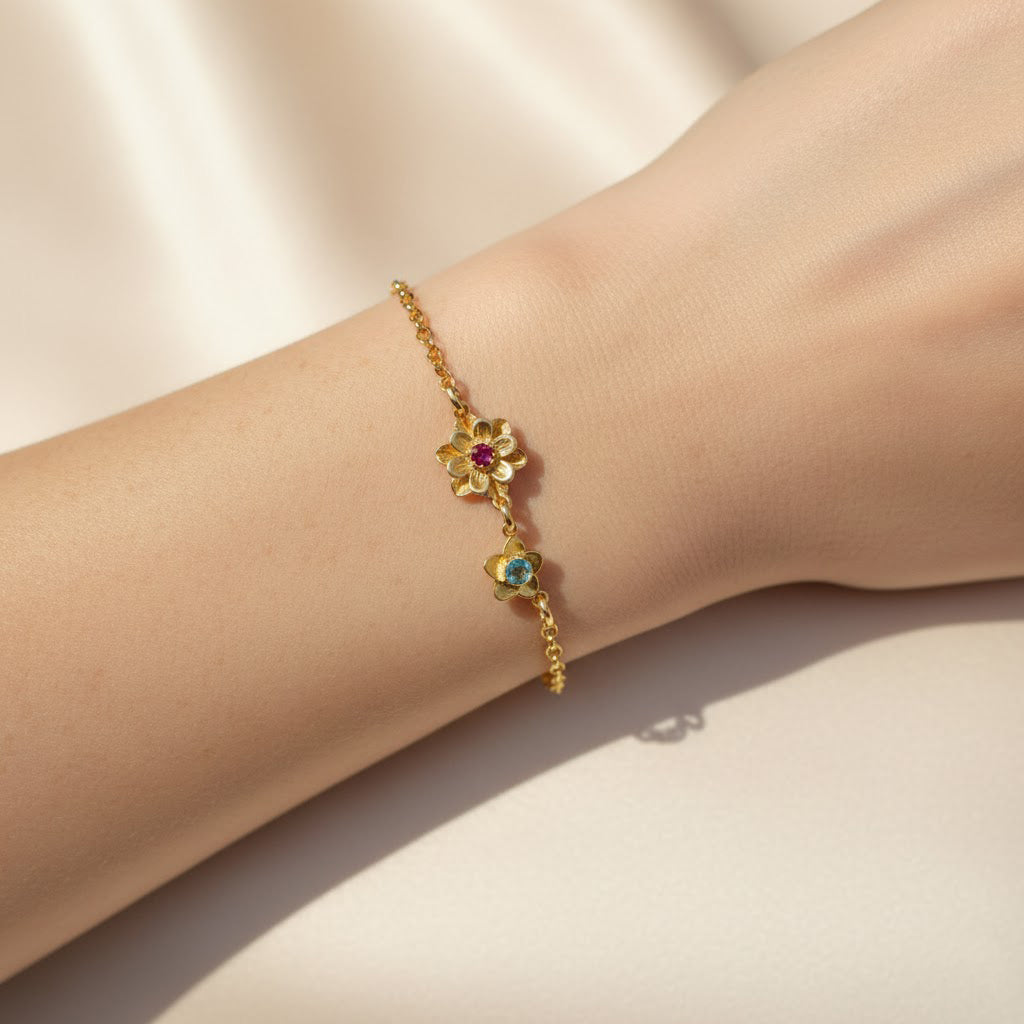 birthstone bracelet for mom featuring multiple kids birthstones in our signature Bloom flower-inspired design shown on wrist for elegant everyday wear meaningful personalized family jewelry crafted in silver gold filled or rose gold filled thoughtful gift for mom grandma or new mom perfect for Mother’s Day birthdays and anniversaries adjustable chain comfortable fit feminine floral birthstone setting celebrating connection between mother and children