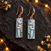 Pink and blue floral dangle earrings with rose gold tone hooks
