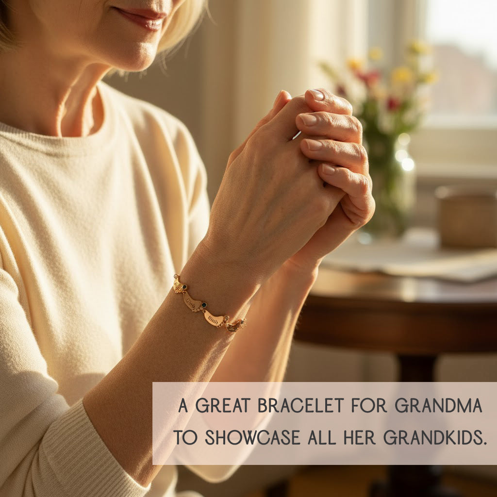 A grandmother fastening a custom engraved footprint bracelet with name charms and birthstones, meaningful mom jewelry that celebrates children or grandchildren, perfect for gifting.