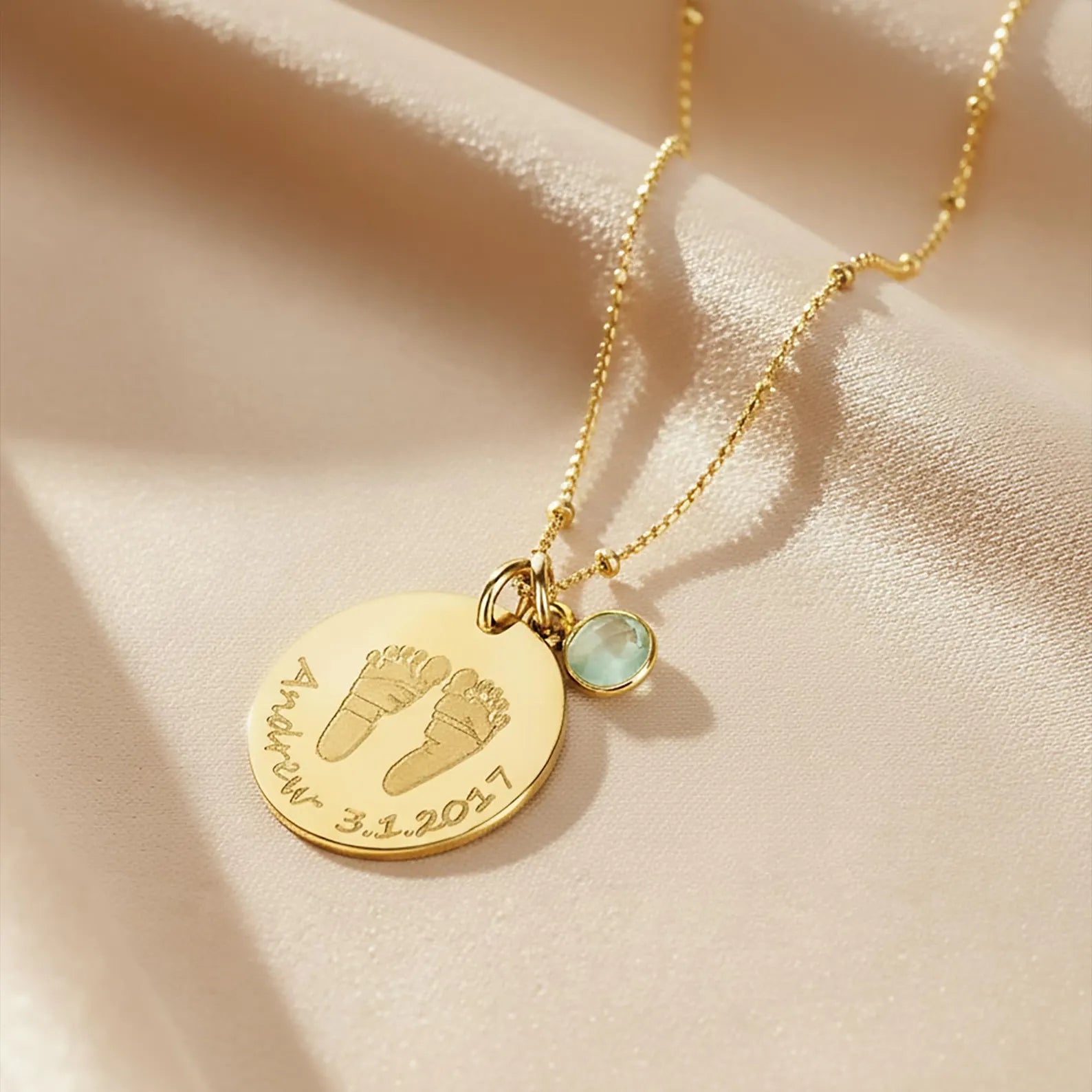 Gold filled necklace engraved with baby's footprints, name and date and add an optional birthstone charm to complete this perfect gift for mom on Mother's Day, for a push present, or birthday gift. 