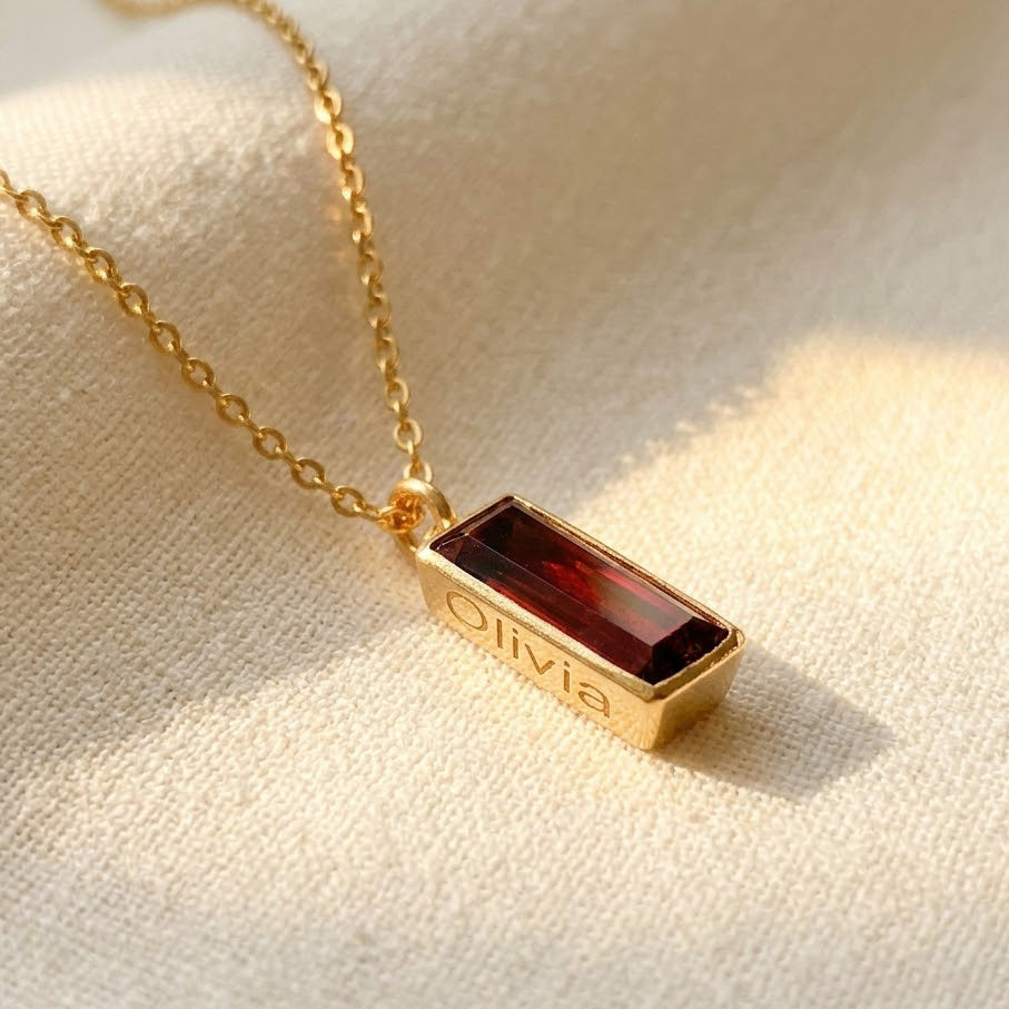 Single gold filled cable chain vertical garnet quartz january birthstone adira bar necklace with secret message engraved on white background