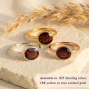 Garnet oval bezel rings in mixed metal finishes—gold vermeil and sterling silver —showing stackable styling; rich red birthstone solitaire rings for January; minimalist, modern oval gemstones; perfect for ring stacks, bridesmaid sets, or mother-daughter gifts; available in sizes 5–10; handcrafted gemstone jewelry.