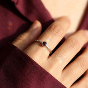 minimalist garnet ring on finger tiny red gemstone ring