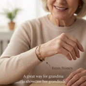 Grandma wearing a personalized birthstone bracelet featuring children’s or grandchildren’s birthstones on a delicate chain. Meaningful family jewelry gift designed to celebrate grandkids and family connections. Custom bracelet handcrafted for everyday wear, perfect gift for grandma on Mother’s Day or birthdays.