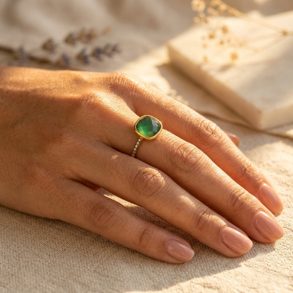 Gold-vermeil green onyx pavé ring worn on a hand in warm natural sunlight.