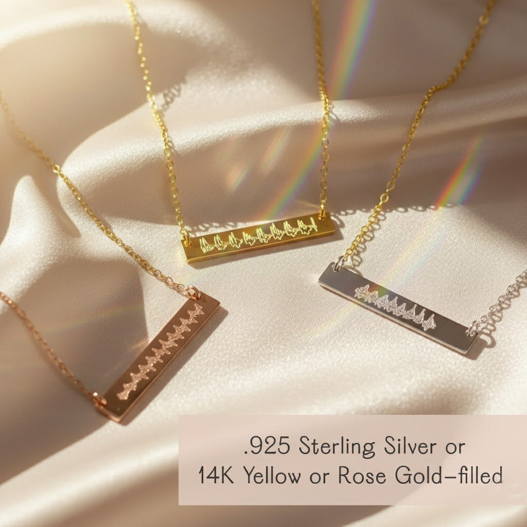 Three elegant engraved bar necklaces in rose gold, yellow gold, and sterling silver tones displayed side by side, featuring delicate soundwave designs symbolizing a baby’s first heartbeat. These heartbeat jewelry pieces are meaningful keepsakes for mothers and families, making a thoughtful pregnancy gift, remembrance jewelry, or personalized push present handcrafted with love and precision.