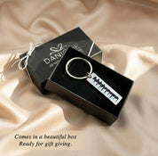 Custom heartbeat keychain presented in branded gift box, ready for gifting. Engraved ultrasound heartbeat keepsake packaged for pregnancy gifts, mom-to-be presents, baby shower gifts, or memorial jewelry.