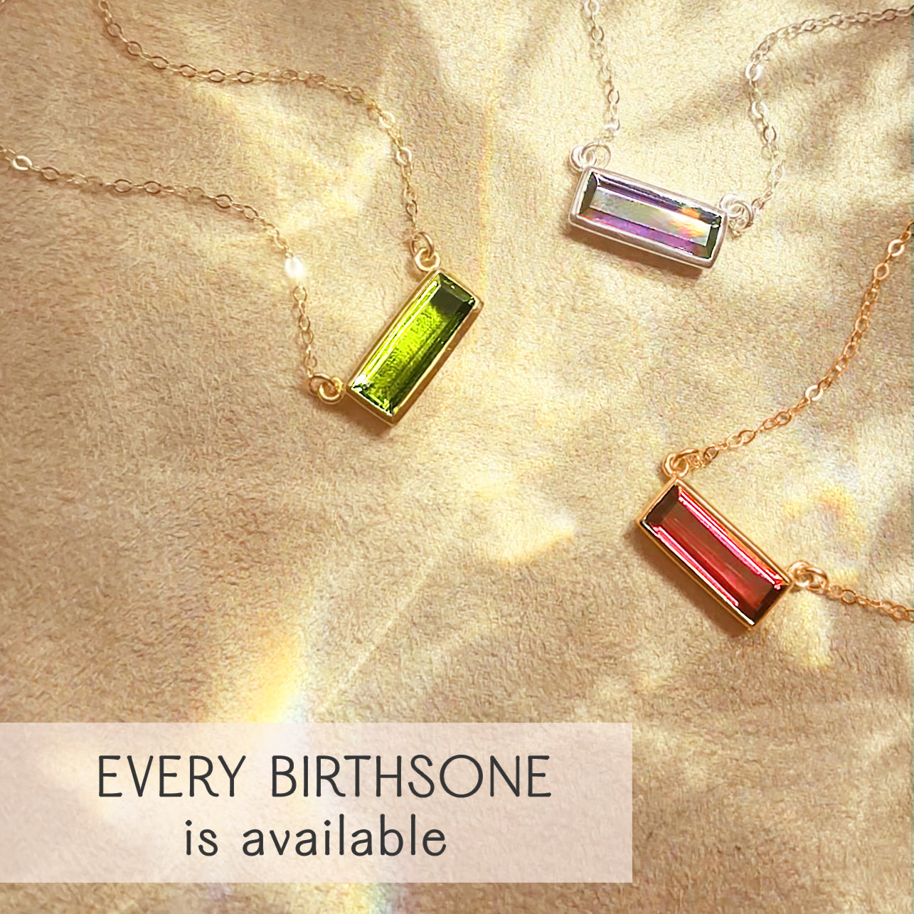 Custom birthstone bar necklaces displayed with peridot, amethyst, and ruby gemstones in sterling silver and gold filled settings, highlighting dainty bezel-set bar pendants with optional name engraving. Perfect personalized jewelry gift for mom, daughter, bridesmaid sets, birthdays, or anniversary gifting. Minimalist handcrafted gemstone necklaces from the Adira collection with every birthstone available and elegant fine chain design.
