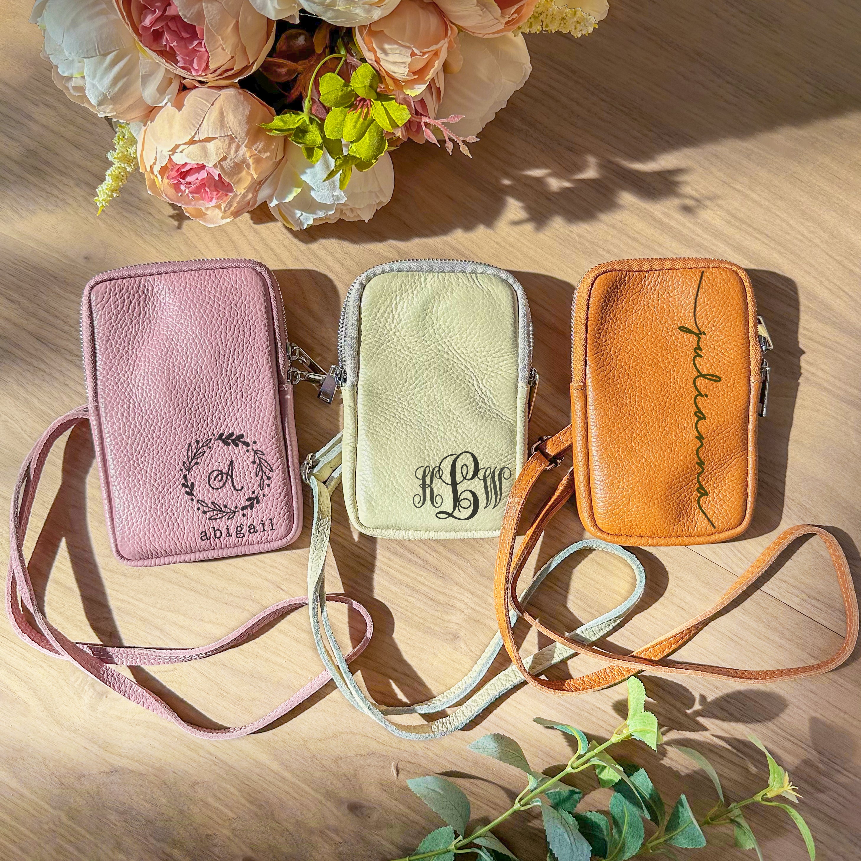 Genuine leather bags in dusty rose with a wreath monogram, ivory with the elegance monogram and brown with a full name engraved. 