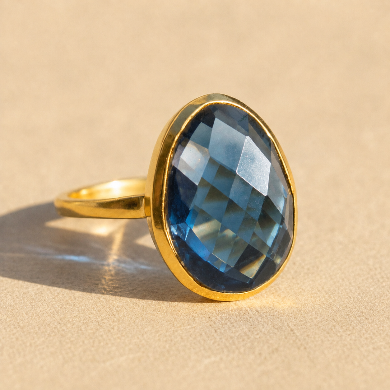 Large teardrop Kyanite ring in yellow gold vermeil with faceted deep blue September birthstone.

