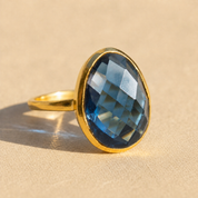 Large teardrop Kyanite ring in yellow gold vermeil with faceted deep blue September birthstone.
