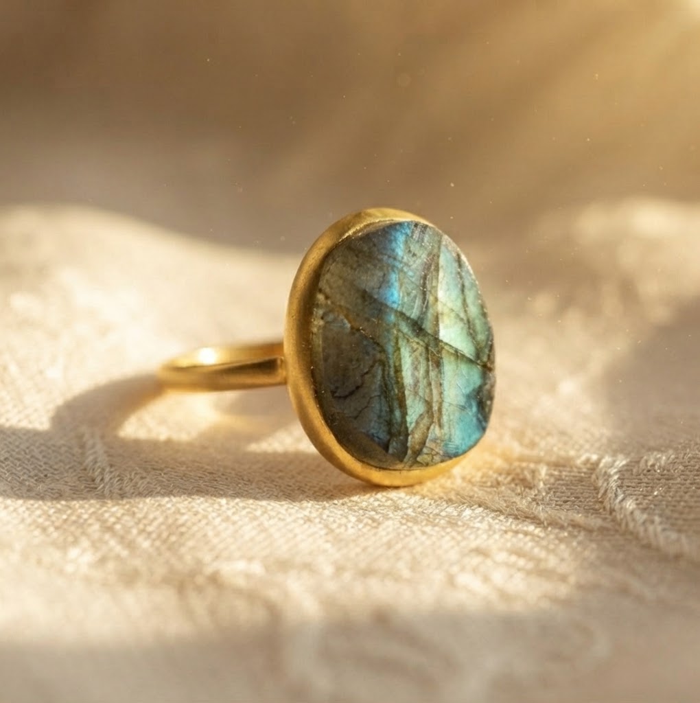 Gold vermeil rough cut labradorite ring showing organic teardrop stone profile and natural green blue flash