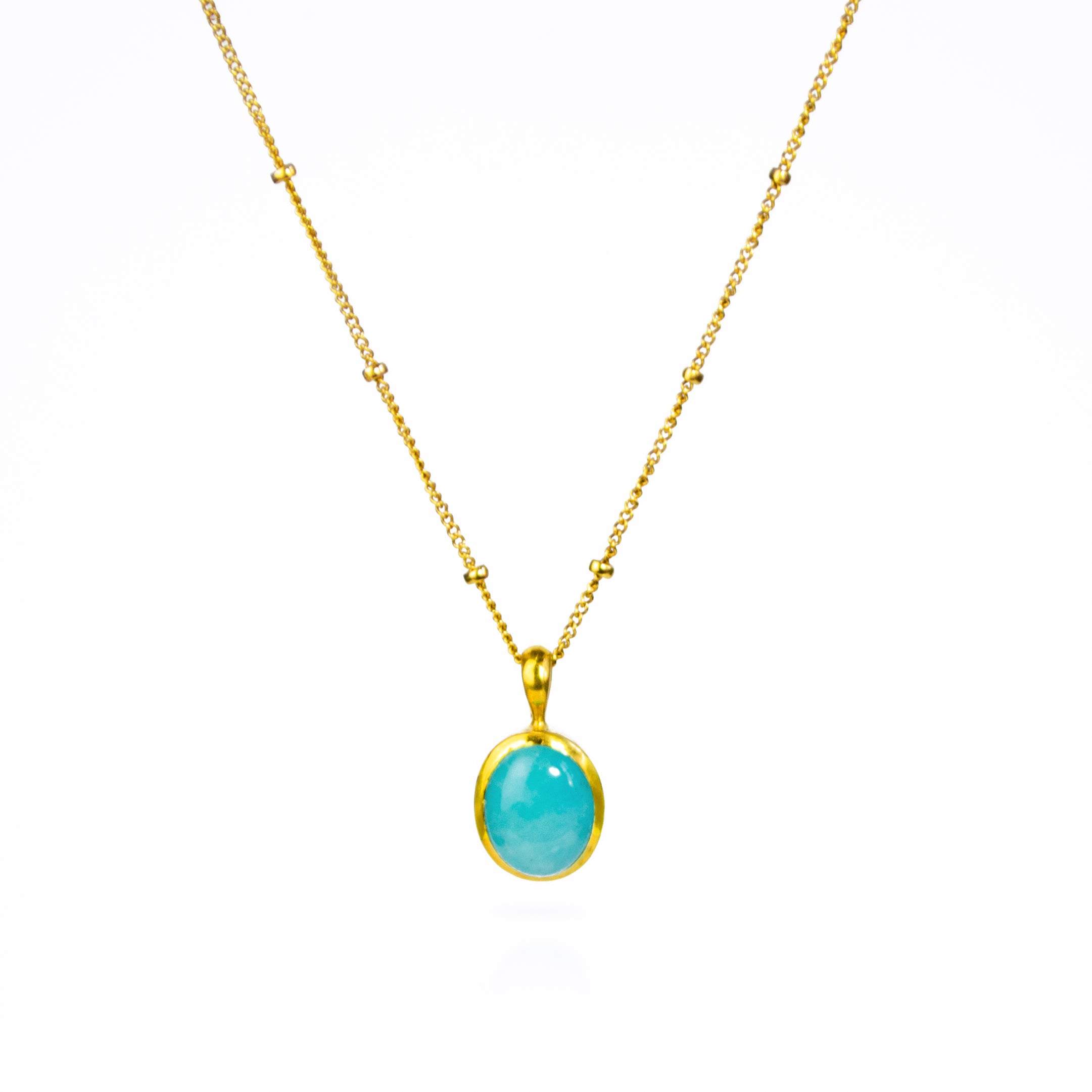 Oval Blue Amazonite Cabochon Bezel Set into a 925 Sterling Silver Pendant Plated in 18k Vermeil Gold sitting on a 14K Gold Filled Satellite Chain against a white background. Soothing Amazonite Crystal Necklace, Heart Healing Gemstone, Dainty Gold