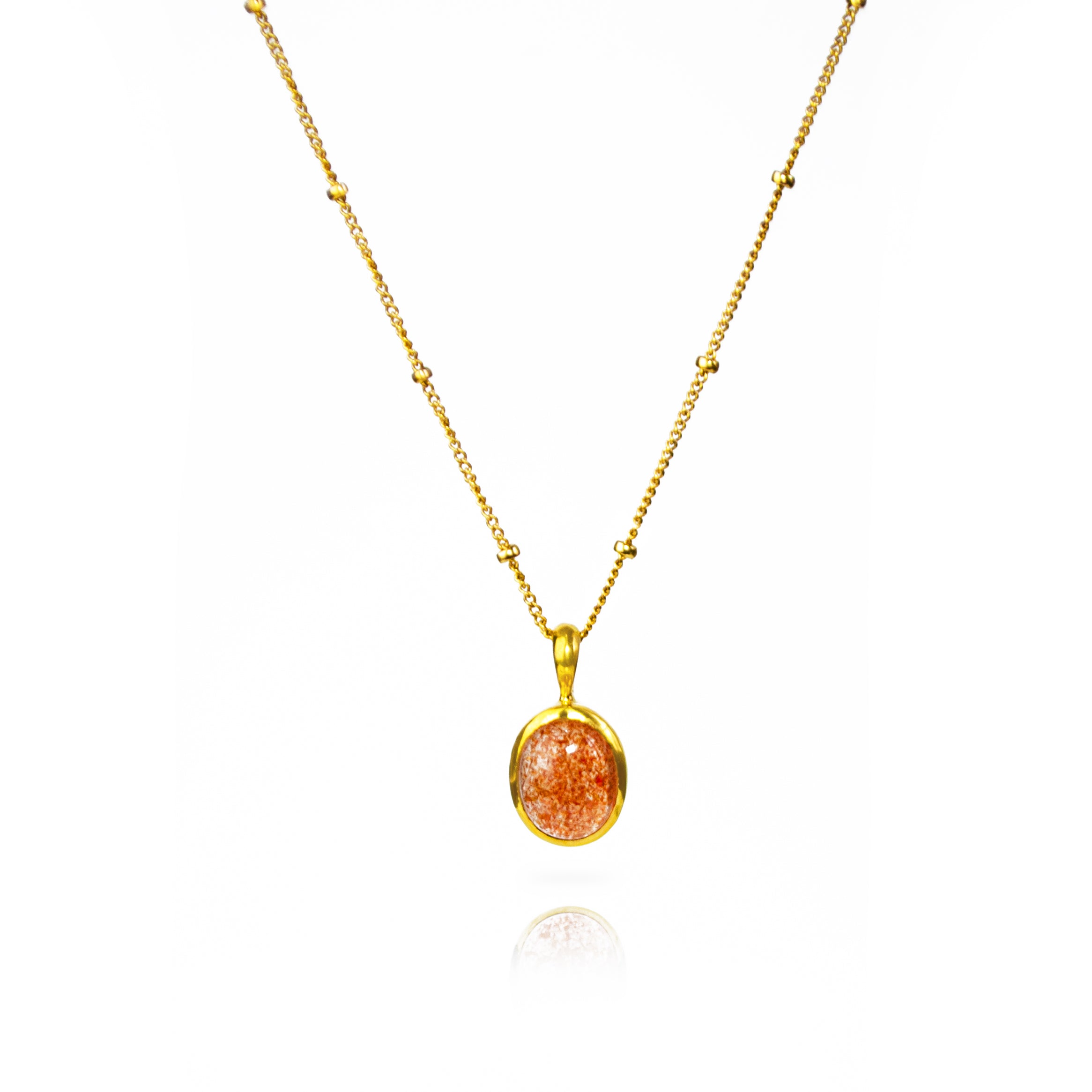 Oval Sunstone Cabochon Bezel Set into a 925 Sterling Silver Pendant Plated in 18k Vermeil Gold sitting on a 14K Gold Filled Satellite Chain against a white background. Shimmering Golden Orange Sunstone Necklace, Dainty Gold Gemstone Necklace,