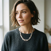 Woman wearing Silver geometric pyramid statement necklace with charcoal sweater
