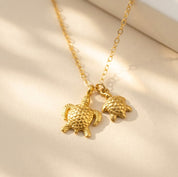 Custom turtle necklace displayed in a Danique Jewelry gift box, ready for Mother’s Day, birthday, or new mom gifting.