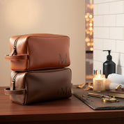 Engraved men's toiletry bag, personalized dopp kit, custom men's Rustic men’s leather toiletry bags engraved with initials, photographed against wood and seasonal décor. Perfect Christmas gift idea for men, husbands, or groomsmen.