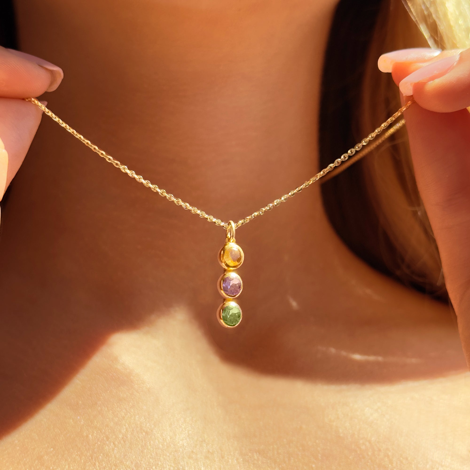 Delicate gold filled birthstone necklace with a single dainty gemstone pendant, worn by a woman for everyday minimalist style. Personalized necklace with birthstone charm, ideal gift for mothers, wives, and daughters. Perfect for birthdays, anniversaries, and Mother’s Day jewelry gifting. Handmade in Massachusetts with attention to detail.