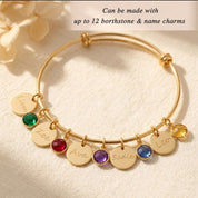 personalized bangle bracelet worn on wrist with engraved charms and birthstones, elegant custom jewelry for women