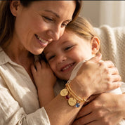 custom engraved bangle bracelet with name charms and birthstones, personalized jewelry on mom hugging her child