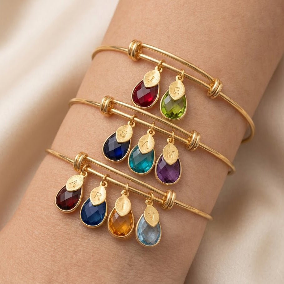 Birthstone charm bracelet with up to multiple gemstones and initial charms personalized family bangle