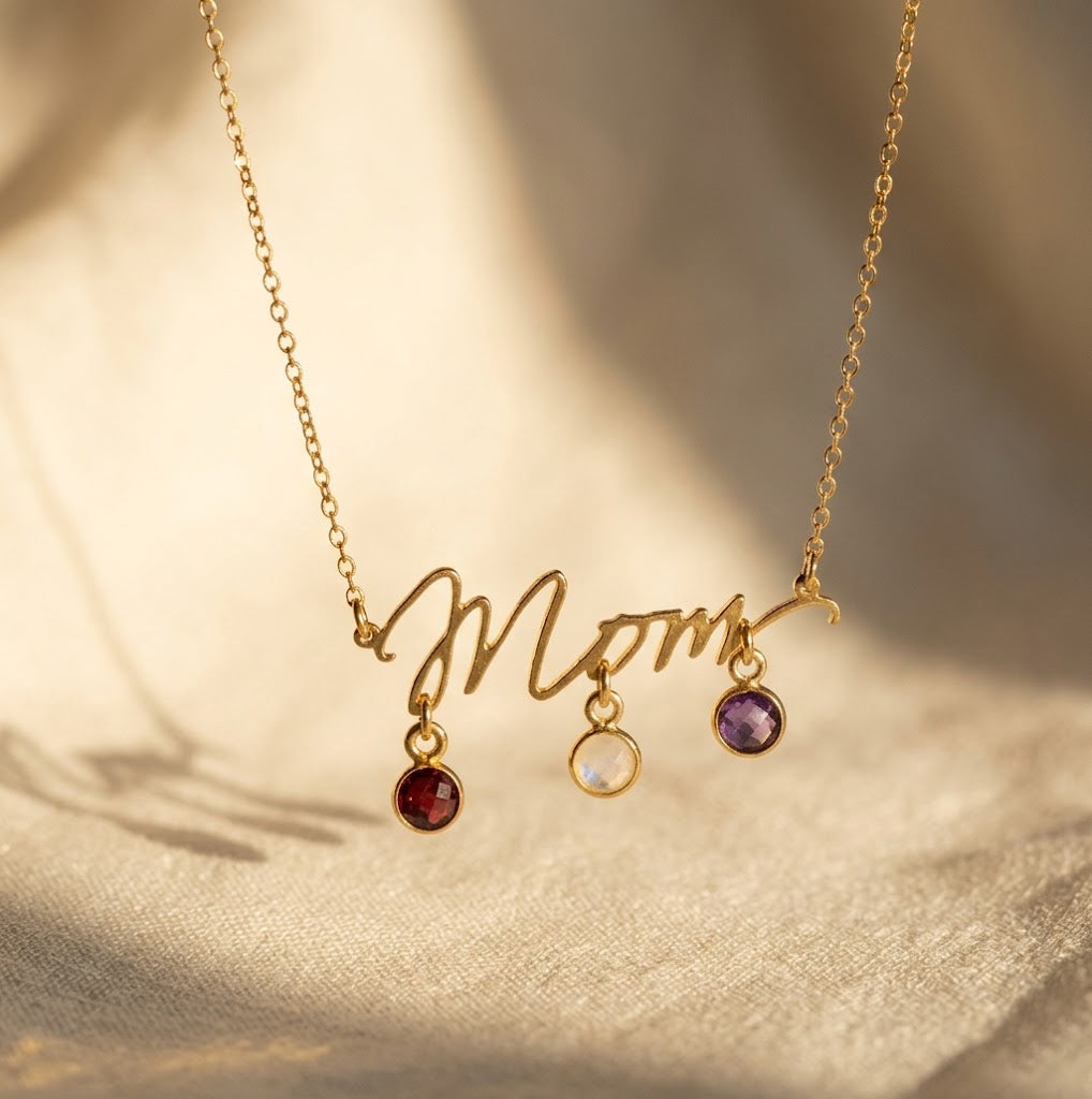 Personalized Mom birthstone necklace with round 6mm checker-faceted gemstone charms in gold, silver, and rose gold finishes.