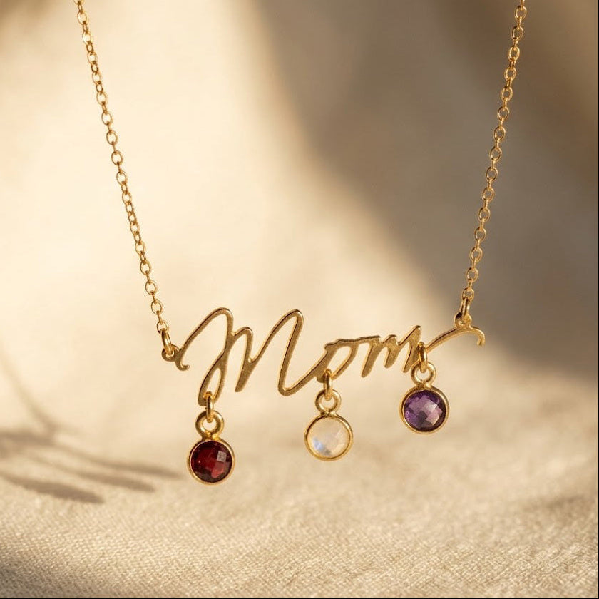 Personalized Mom birthstone necklace with round 6mm checker-faceted gemstone charms in gold, silver, and rose gold finishes.