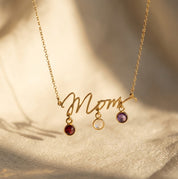Personalized Mom birthstone necklace with round 6mm checker-faceted gemstone charms in gold, silver, and rose gold finishes.