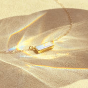 June Birthstone rainbow moonstone horizontal bar necklace with a gold filled chain.