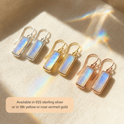 Moonstone bar earrings in sterling silver, yellow gold, and rose gold with text explaining available metal finishes.