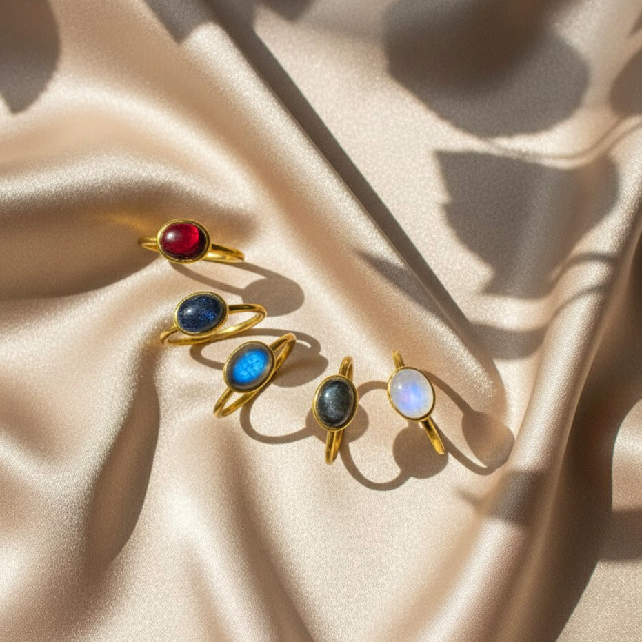 Minimalist oval rainbow moonstone, labradorite, garnet, sunstone rings in gold vermeil, designed as a June birthday gift for her.